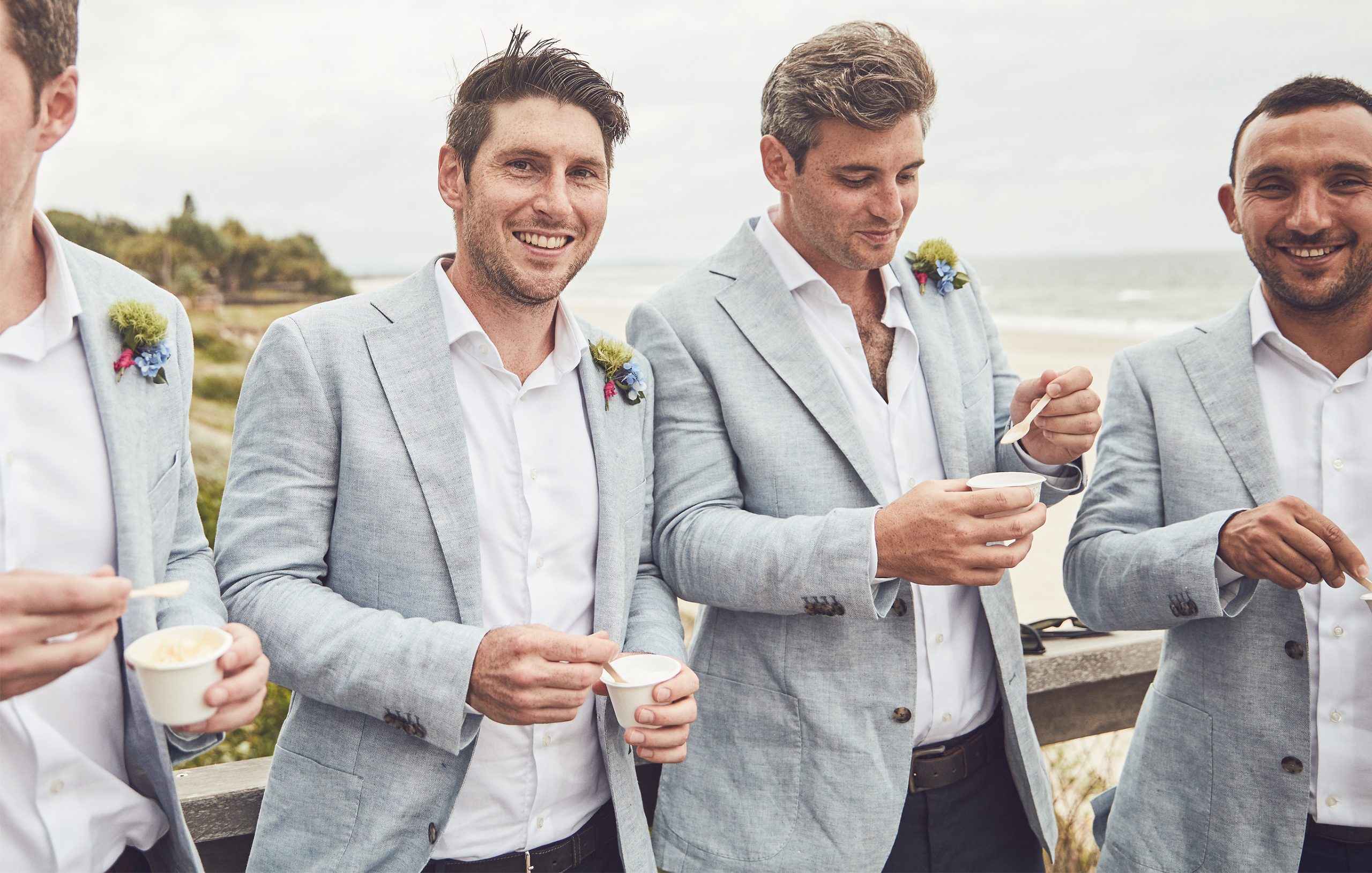 Groom and groomsmen laughing